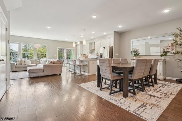 dining area featuring recessed lighting and hardwood / wood-style flooring