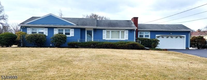 26 Brandywine Rd, Wayne Twp, NJ 07470 - ranch-style home featuring an attached garage, a chimney, driveway, and a front yard