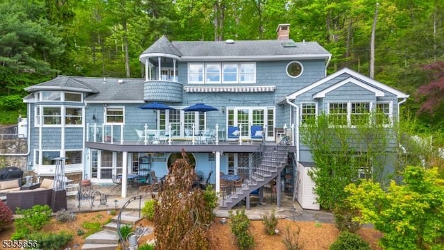 40 Hemlock Ave, Andover Twp, NJ 07860 - back of house featuring a patio, a chimney, a wooden deck, stairs, and a sunroom