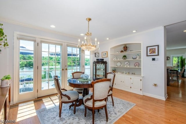 40 Hemlock Ave, Andover Twp, NJ 07860 - dining room with crown molding, healthy amount of natural light, a chandelier, french doors, and light wood-type flooring