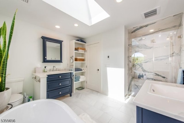 40 Hemlock Ave, Andover Twp, NJ 07860 - full bath with a marble finish shower, a skylight, vanity, recessed lighting, and toilet
