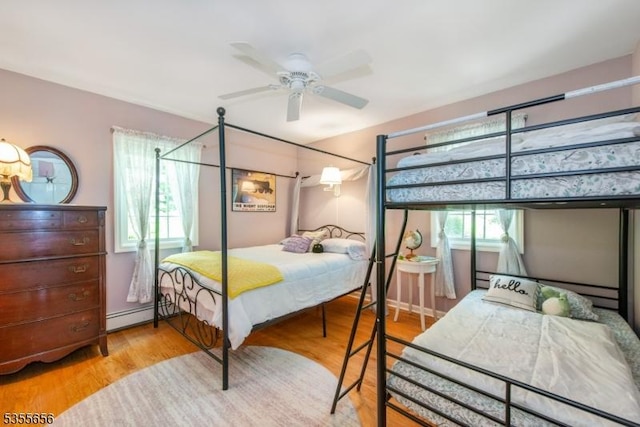 40 Hemlock Ave, Andover Twp, NJ 07860 - bedroom featuring wood finished floors and a baseboard heating unit