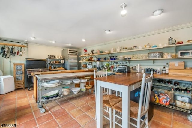 40 Hemlock Ave, Andover Twp, NJ 07860 - kitchen with crown molding, stainless steel built in fridge, tile patterned floors, and open shelves