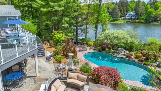 40 Hemlock Ave, Andover Twp, NJ 07860 - outdoor pool featuring a patio, a water view, and view of scattered trees