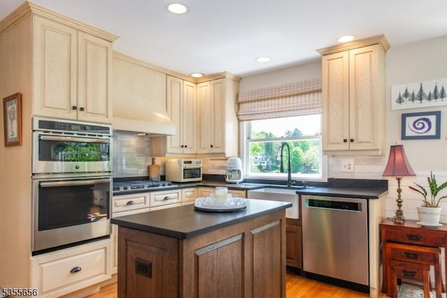 40 Hemlock Ave, Andover Twp, NJ 07860 - kitchen with appliances with stainless steel finishes, dark countertops, a sink, decorative backsplash, and recessed lighting