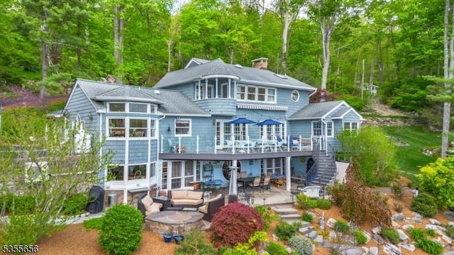 40 Hemlock Ave, Andover Twp, NJ 07860 - back of property with a patio area, outdoor lounge area, stairway, a deck, and outdoor dining space
