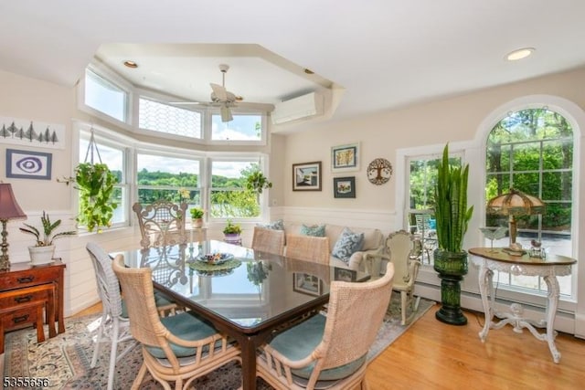 40 Hemlock Ave, Andover Twp, NJ 07860 - dining space with ceiling fan, an AC wall unit, wainscoting, wood finished floors, and recessed lighting