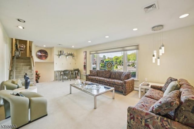 living area featuring carpet, stairs, and recessed lighting