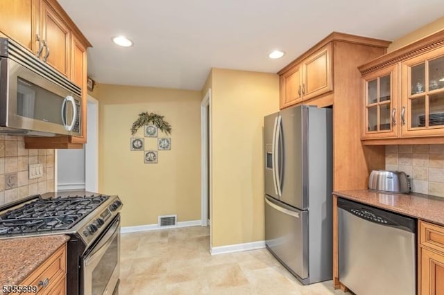130 Coriell Ave, Fanwood Boro, NJ 07023 - kitchen with appliances with stainless steel finishes, light stone countertops, backsplash, recessed lighting, and brown cabinets