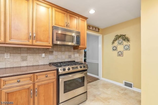130 Coriell Ave, Fanwood Boro, NJ 07023 - kitchen featuring stainless steel appliances, decorative backsplash, baseboards, stone countertops, and recessed lighting