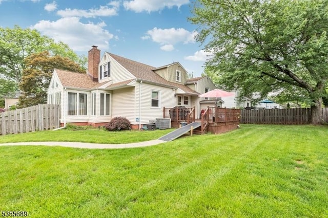 130 Coriell Ave, Fanwood Boro, NJ 07023 - back of property with a chimney, a wooden deck, and roof with shingles