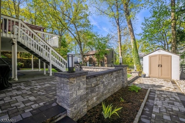 10 Tulsa Trl, Hopatcong Boro, NJ 07843 - exterior space featuring a storage shed, an outbuilding, stairway, and a wooden deck