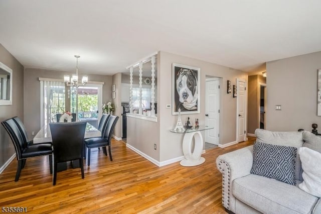 10 Tulsa Trl, Hopatcong Boro, NJ 07843 - dining room featuring baseboards, a notable chandelier, and light wood finished floors