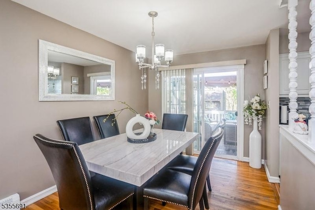 10 Tulsa Trl, Hopatcong Boro, NJ 07843 - dining space with plenty of natural light, a chandelier, wood finished floors, and baseboards