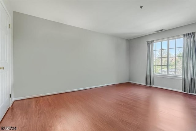 81 Village Dr Unit 81, Morris Twp, NJ 07960 - spare room with baseboards, visible vents, and wood finished floors