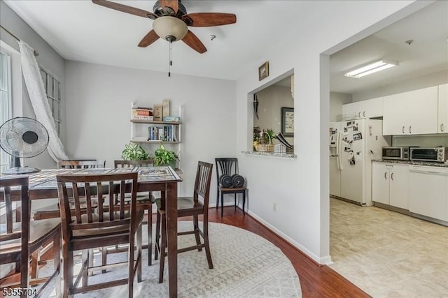 81 Village Dr Unit 81, Morris Twp, NJ 07960 - dining room featuring a toaster, baseboards, ceiling fan, and light wood-type flooring
