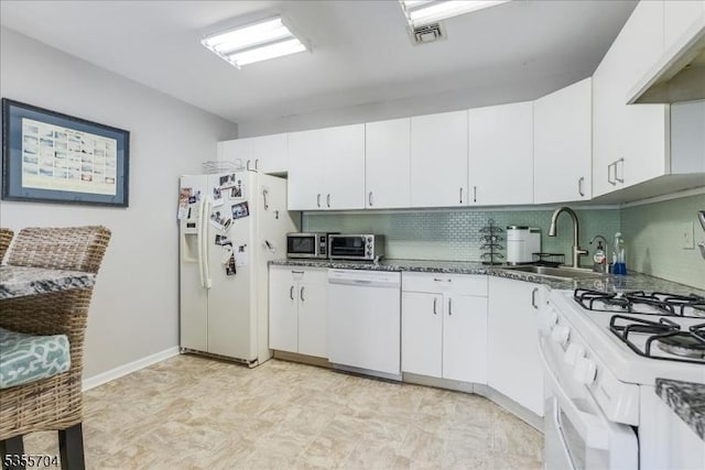 81 Village Dr Unit 81, Morris Twp, NJ 07960 - kitchen with white appliances, decorative backsplash, white cabinets, and a sink