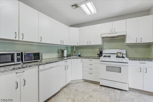 81 Village Dr Unit 81, Morris Twp, NJ 07960 - kitchen with a sink, dark stone counters, visible vents, white appliances, and under cabinet range hood