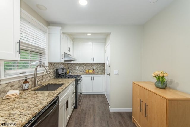 kitchen featuring stainless steel range with gas stovetop, a sink, dark wood-type flooring, dishwashing machine, and white cabinets