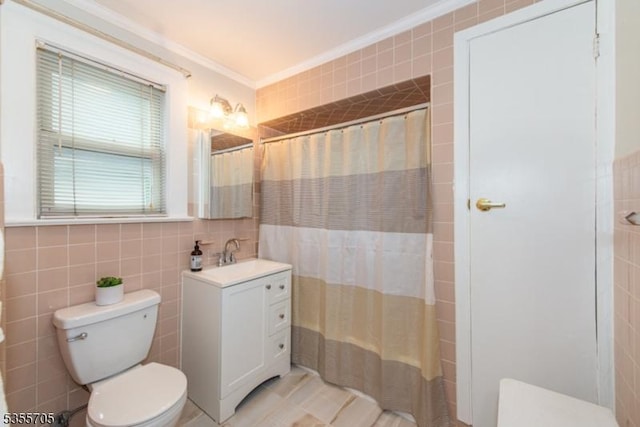 full bathroom with tile walls, ornamental molding, toilet, vanity, and a shower with shower curtain