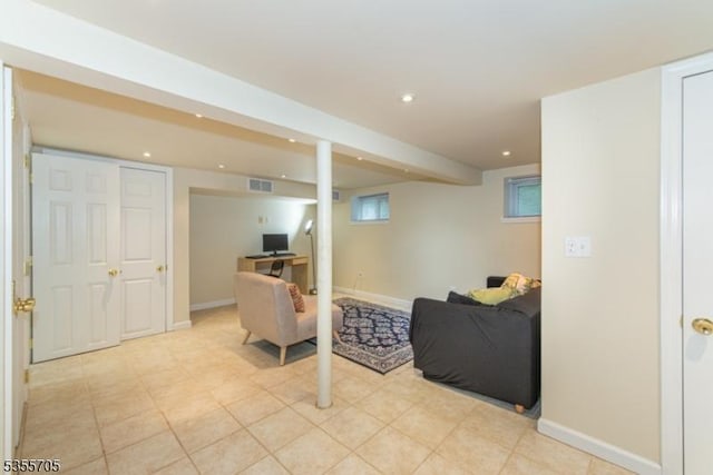 living room featuring recessed lighting and baseboards