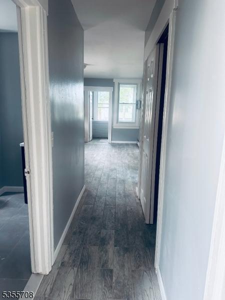 553-555 S 10th St, Newark City, NJ 07103 - hall featuring baseboards and wood finished floors