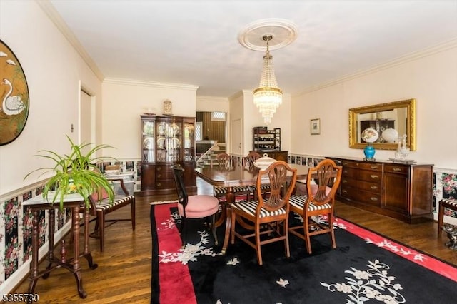 197 Nutley Ave, Nutley Twp, NJ 07110 - dining area with dark wood-type flooring, crown molding, and a chandelier