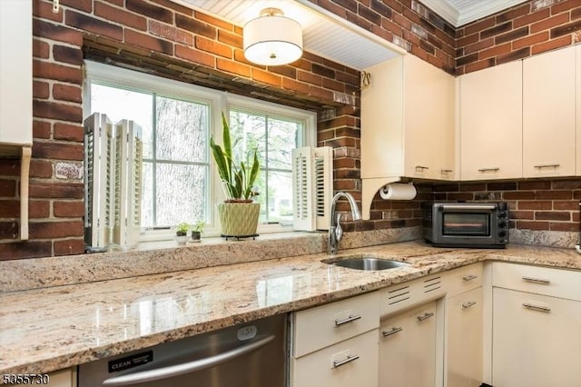 197 Nutley Ave, Nutley Twp, NJ 07110 - kitchen with a sink, stainless steel dishwasher, decorative backsplash, white cabinetry, and light stone countertops