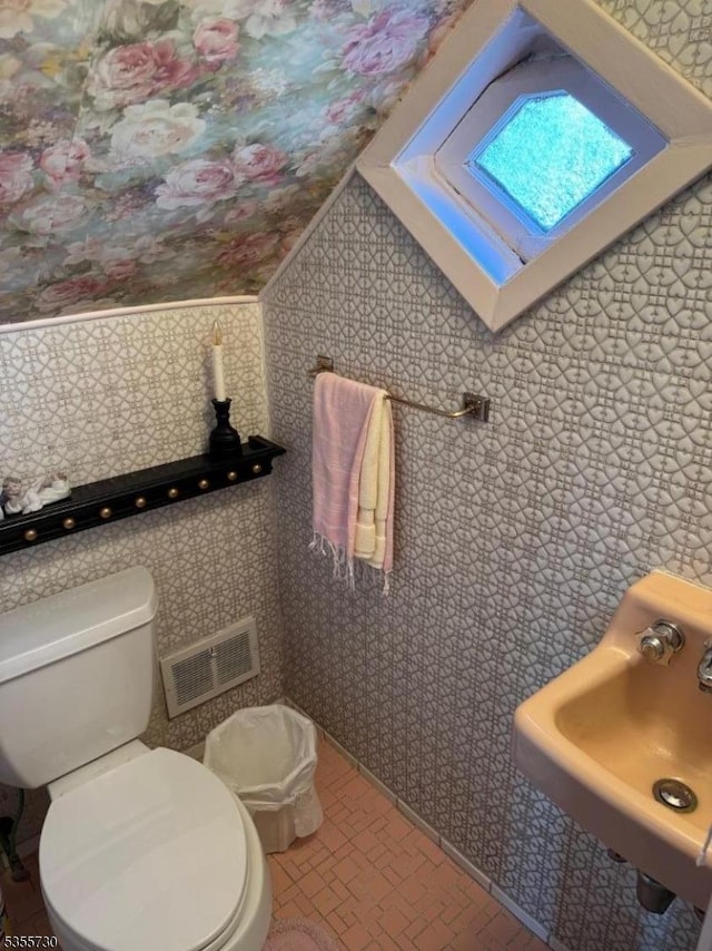 197 Nutley Ave, Nutley Twp, NJ 07110 - half bathroom featuring wallpapered walls, toilet, and a sink