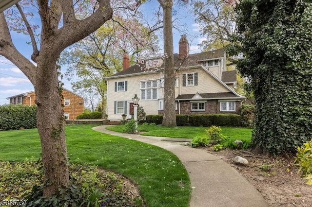 197 Nutley Ave, Nutley Twp, NJ 07110 - view of front of home with a chimney and a front lawn