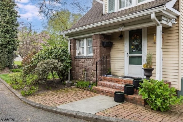 197 Nutley Ave, Nutley Twp, NJ 07110 - entrance to property with roof with shingles and stone siding