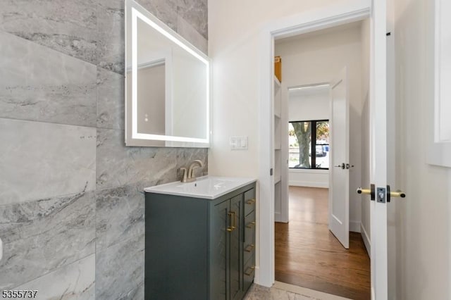 bathroom featuring vanity and wood finished floors