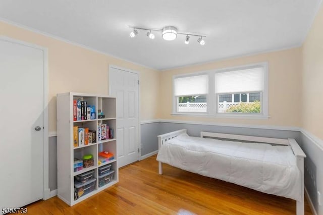 bedroom featuring wood finished floors