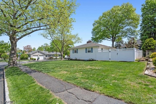 view of yard featuring a garage