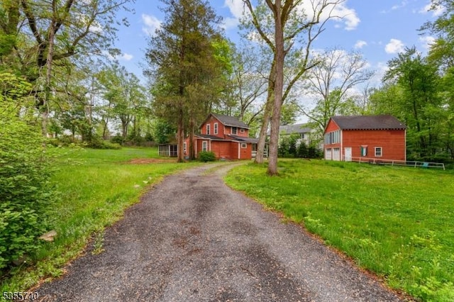 194 James St, Morris Twp, NJ 07960 - view of side of property with a garage, a lawn, and driveway
