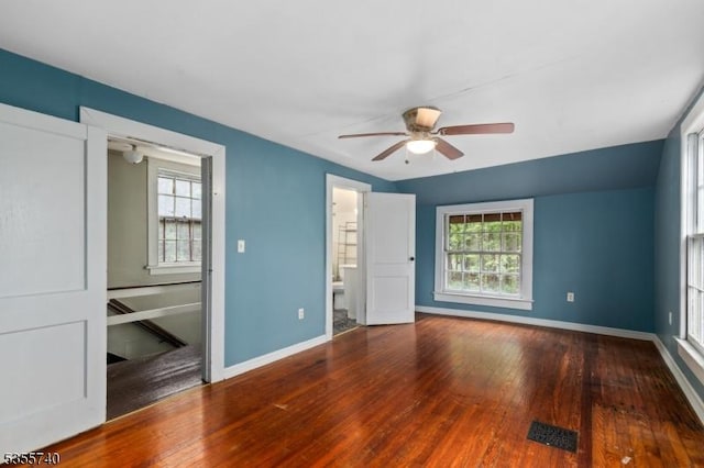 194 James St, Morris Twp, NJ 07960 - unfurnished bedroom featuring hardwood / wood-style flooring, baseboards, and connected bathroom