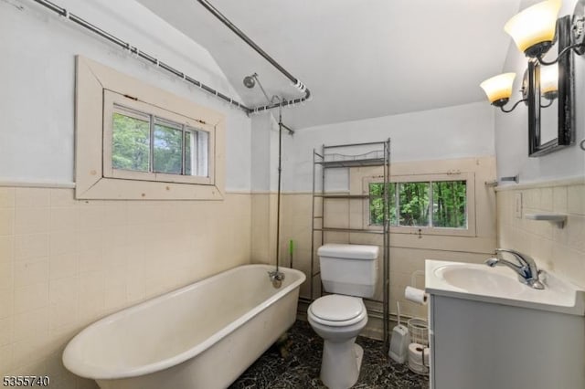 194 James St, Morris Twp, NJ 07960 - full bathroom with tile walls, a freestanding tub, toilet, plenty of natural light, and vanity