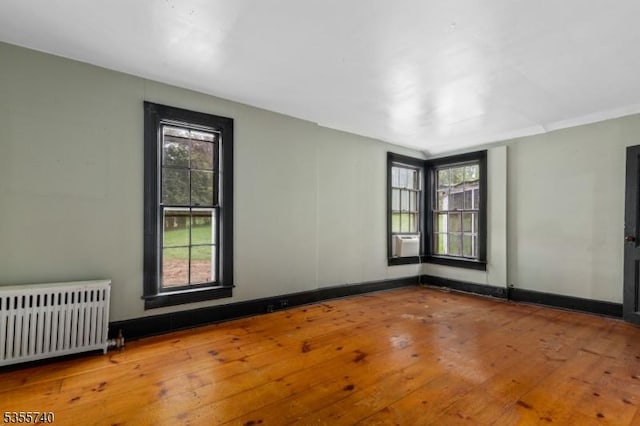 194 James St, Morris Twp, NJ 07960 - spare room featuring radiator heating unit, hardwood / wood-style floors, healthy amount of natural light, and cooling unit