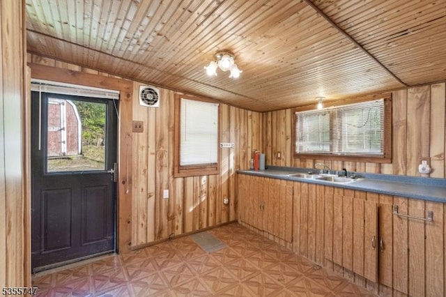 55 E Shore Culver Rd, Frankford Twp, NJ 07826 - kitchen featuring brown cabinets, a sink, wood walls, visible vents, and wooden ceiling