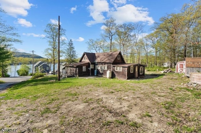 55 E Shore Culver Rd, Frankford Twp, NJ 07826 - view of side of home with a storage shed, an outdoor structure, and a lawn