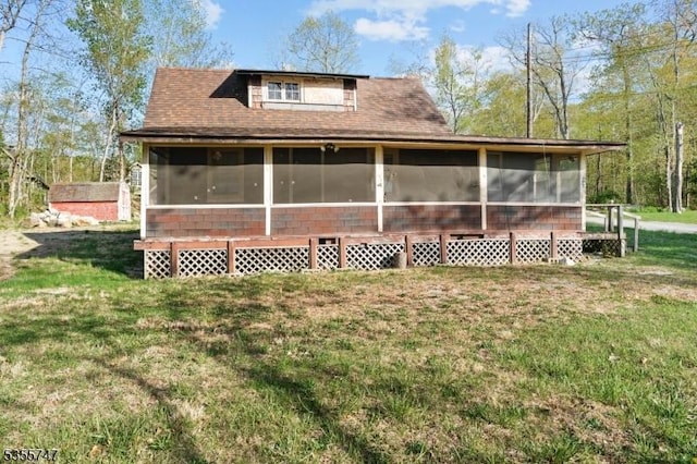 55 E Shore Culver Rd, Frankford Twp, NJ 07826 - back of property featuring a lawn, a sunroom, and a shingled roof