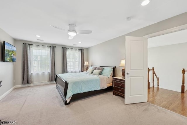 bedroom with light carpet, recessed lighting, a ceiling fan, and baseboards