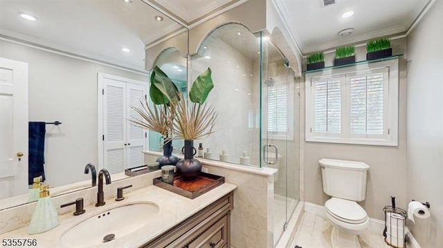 bathroom with a stall shower, toilet, a wealth of natural light, vanity, and crown molding