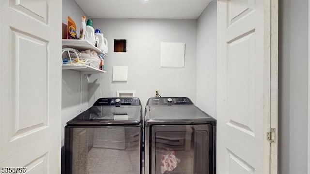 laundry area with separate washer and dryer and laundry area