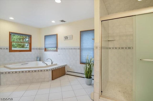 33 Lockwood Pl, Clifton City, NJ 07012 - full bath featuring a baseboard radiator, a garden tub, a shower stall, tile walls, and tile patterned flooring