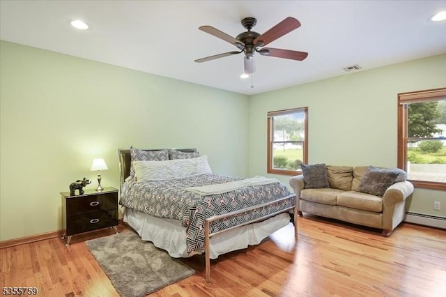 33 Lockwood Pl, Clifton City, NJ 07012 - bedroom with wood finished floors, recessed lighting, a ceiling fan, baseboards, and a baseboard radiator