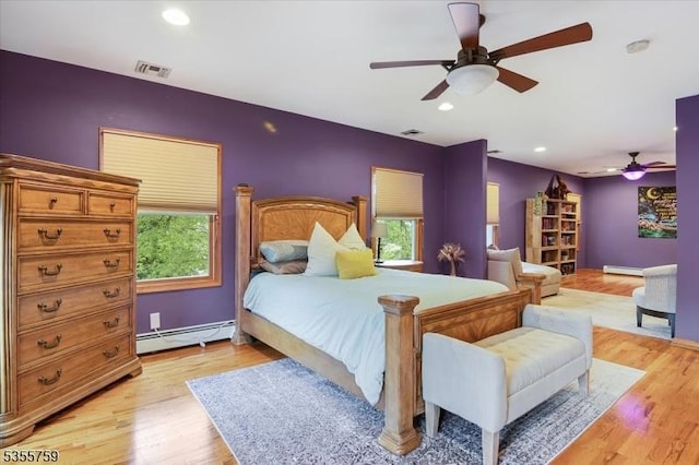 33 Lockwood Pl, Clifton City, NJ 07012 - bedroom with a baseboard heating unit, multiple windows, light wood finished floors, ceiling fan, and recessed lighting