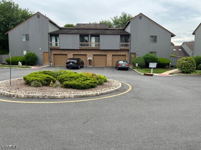 87 Sycamore Ct, Bernards Twp, NJ 07920 - view of front facade with a garage, driveway, and brick siding