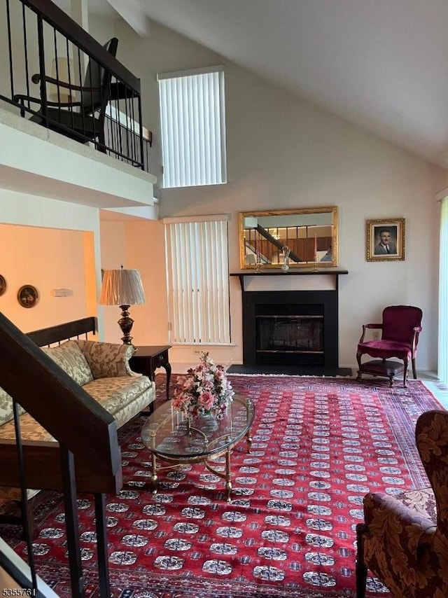 87 Sycamore Ct, Bernards Twp, NJ 07920 - living room with high vaulted ceiling, a glass covered fireplace, and stairway