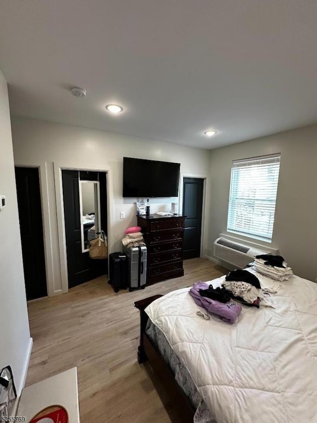 86 N 7th St, Paterson City, NJ 07522 - bedroom with light wood finished floors, a wall mounted AC, and recessed lighting